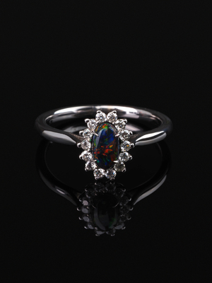 Black opal gold ring with diamonds