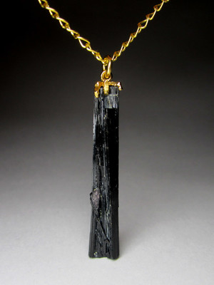 Gold pendant with black tourmaline