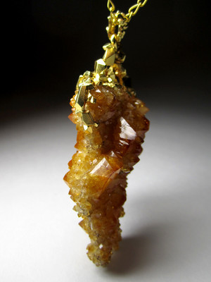 Pendant of citrine in silver with gold-plated