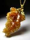 Pendant of citrine in silver with gold-plated