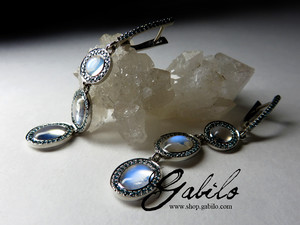 Moonstone gold earrings with blue diamonds