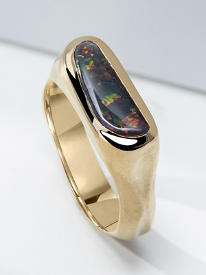Black opal yellow gold ring