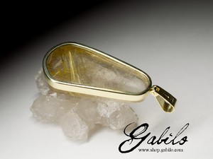 Gold pendant with rutilated quartz