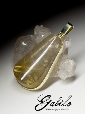 Gold pendant with rutilated quartz