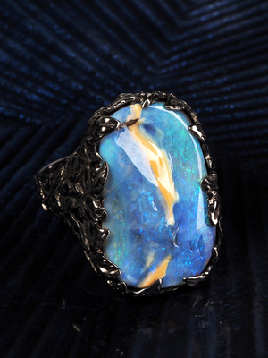 Ivy ring with boulder opal in black gold